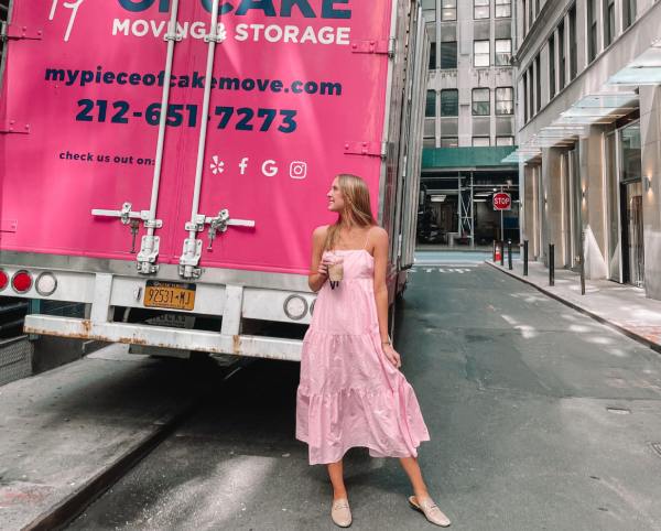 smiling-customer-piece-of-cake-pink-moving-truck