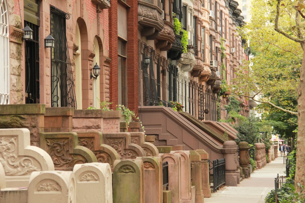 A,Row,Of,Various,Colored,Brownstones,In,Uptown,Manhattan,,Nyc