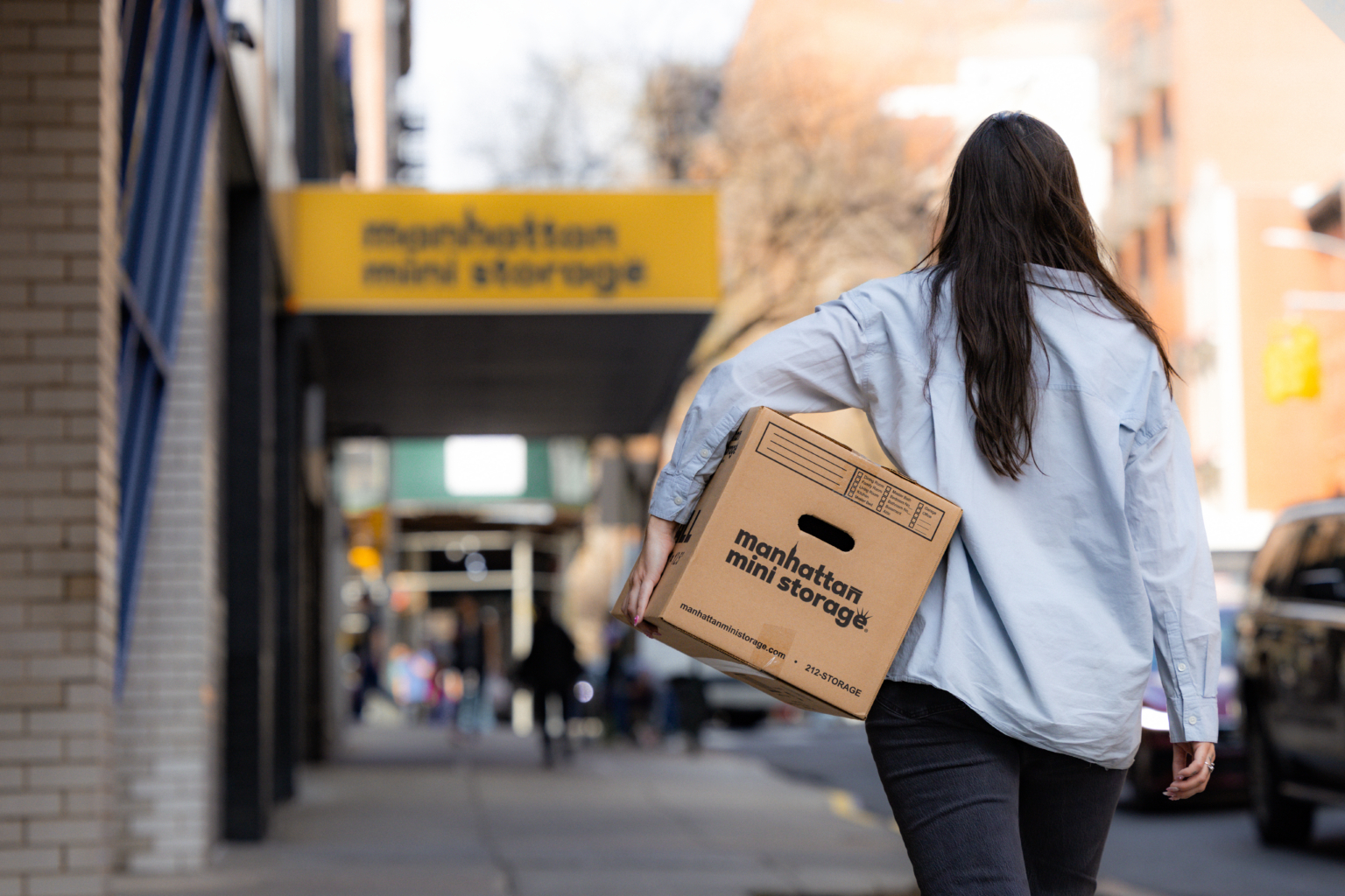 Woman-holding-manhattan-mini-storage-box